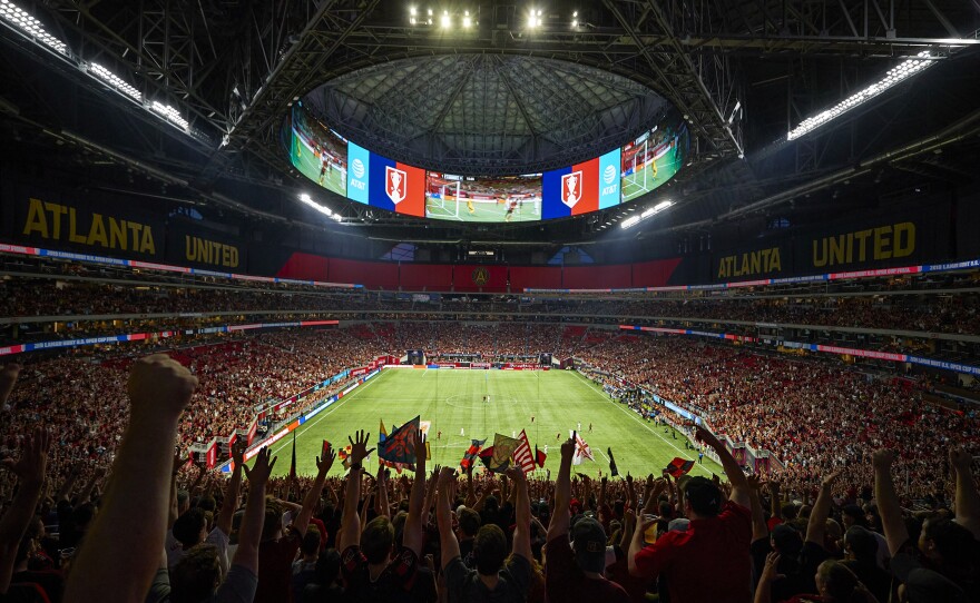 Fans of the MLS' Atlanta United wave banners at Mercedes-Benz Stadium in Atlanta, a likely venue for matches in the 2026 World Cup.