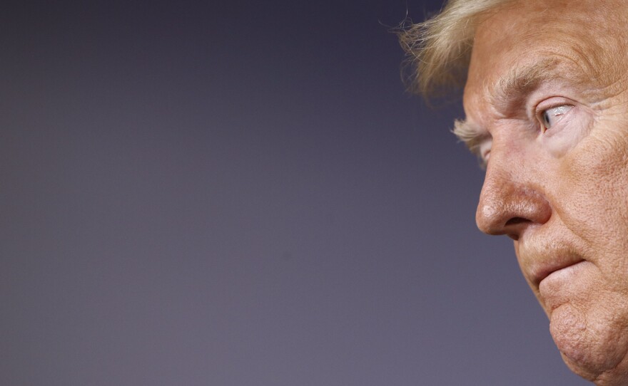 President Trump says he views the battle against the coronavirus through the lens of a wartime president.