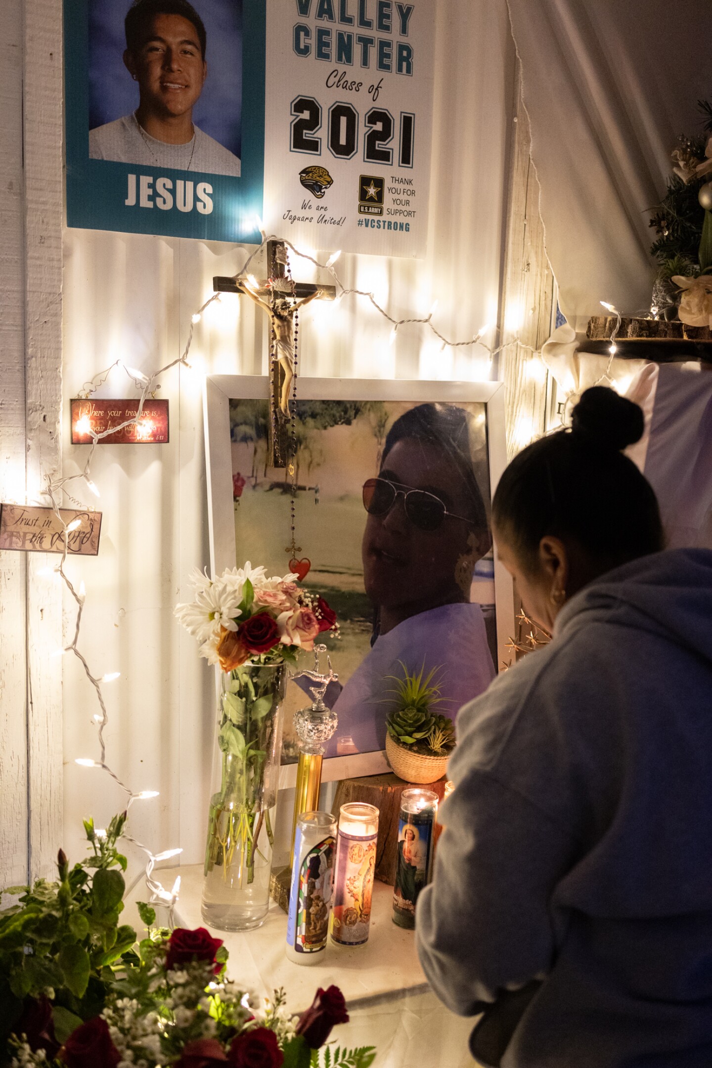 Jesús Manuel Saldaña Rocha's mother stands in front of an altar for her son and a monthly gathering of family and friends to remember him, Feb. 20, 2023.