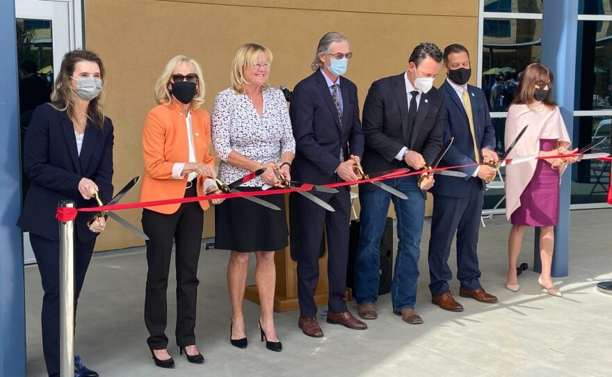 County officials cut a ceremonial ribbon to open the Youth Transition Center on Jan. 28, 2022