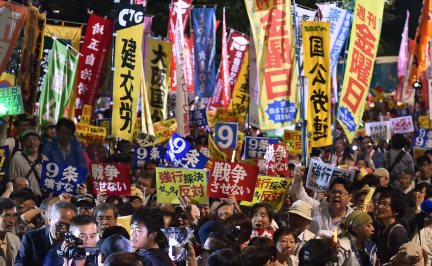 Demonstrators rally against Japanese Prime Minister Shinzo Abe's controversial security bills in front of the National Diet in Tokyo in September. The bills passed and will allow Japan to send its troops overseas for the first time since World War II. However, the likelihood of Japanese involvement in a foreign war appears quite small.