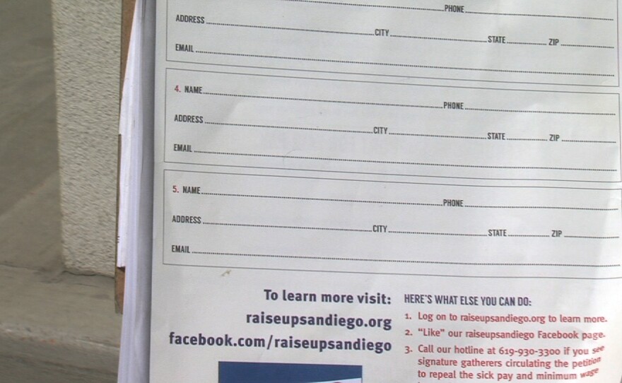 The Raise Up San Diego petition that asks voters not to sign the official petition to force San Diego's minimum wage increase on the ballot. Two Raise Up volunteers held the petition outside the Clairemont Home Depot on Monday, August 25, 2014.