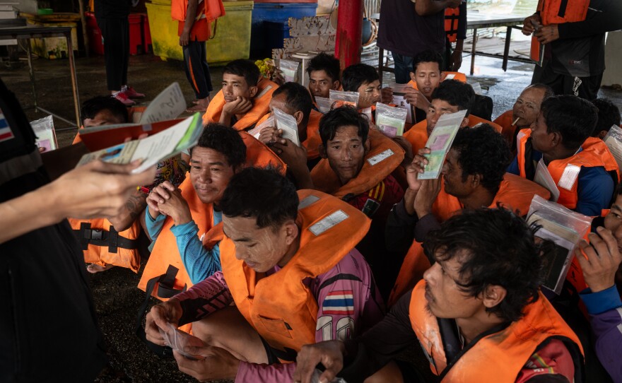 Members of a crew working on a Thai fishing vessel, most of whom are from Myanmar, prepare to show their documents to Port In Port Out (PIPO) inspectors in Chumphon, Thailand, on Jan. 22, 2025. PIPO inspection centers were set up in 2018, following an outcry in the international community over Thailand's gross human rights abuses in its fishing industry.