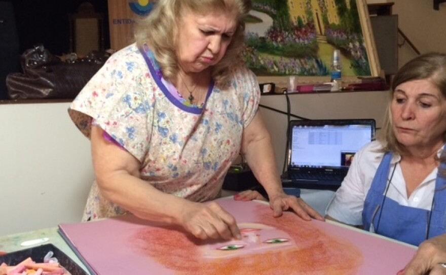 Valdelice Da Silva Dias Salum, 77, says she channels the spirits of French Impressionist painters to create her artwork.