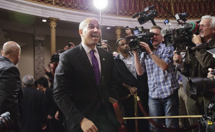 Democratic Sen. Cory Booker, formerly mayor of Newark, N.J., arrives in the Old Senate Chamber on Thursday for an oath-of-office ceremony.