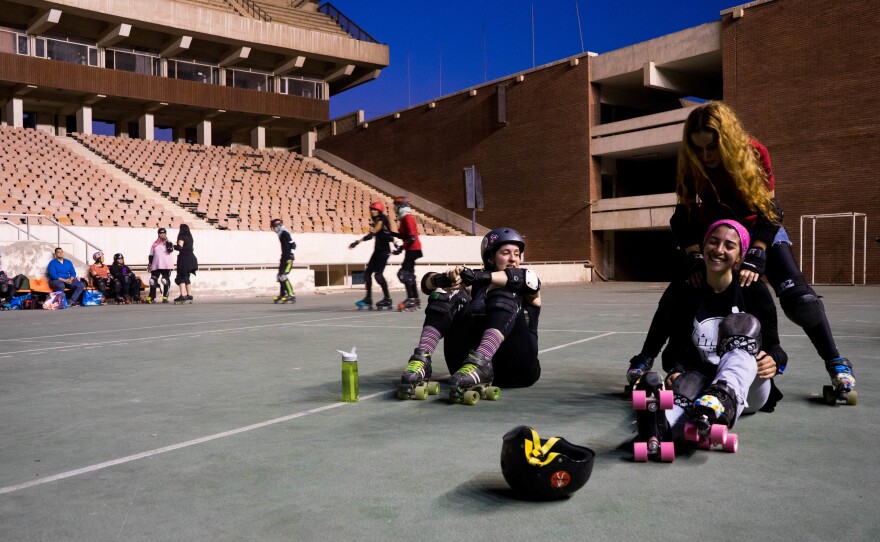 Sumer Abdelnasser (lower right) laughs at Nermine Abi Aad's joke during a practice break.