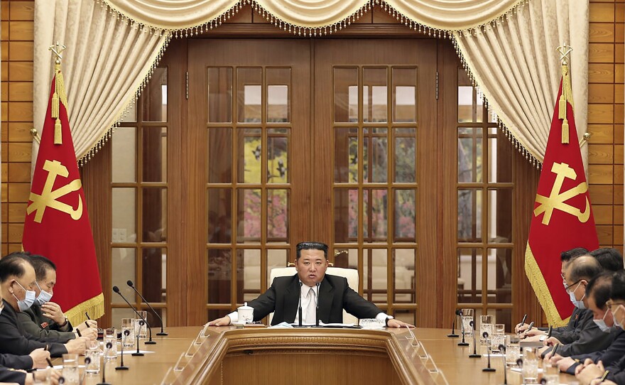 In this photo provided by the North Korean government, North Korean leader Kim Jong Un, center, attends a meeting of the Central Committee of the ruling Workers' Party in Pyongyang, North Korea Thursday, May 12, 2022. Independent journalists were not given access to cover the event depicted in this image distributed by the North Korean government. The content of this image is as provided and cannot be independently verified.