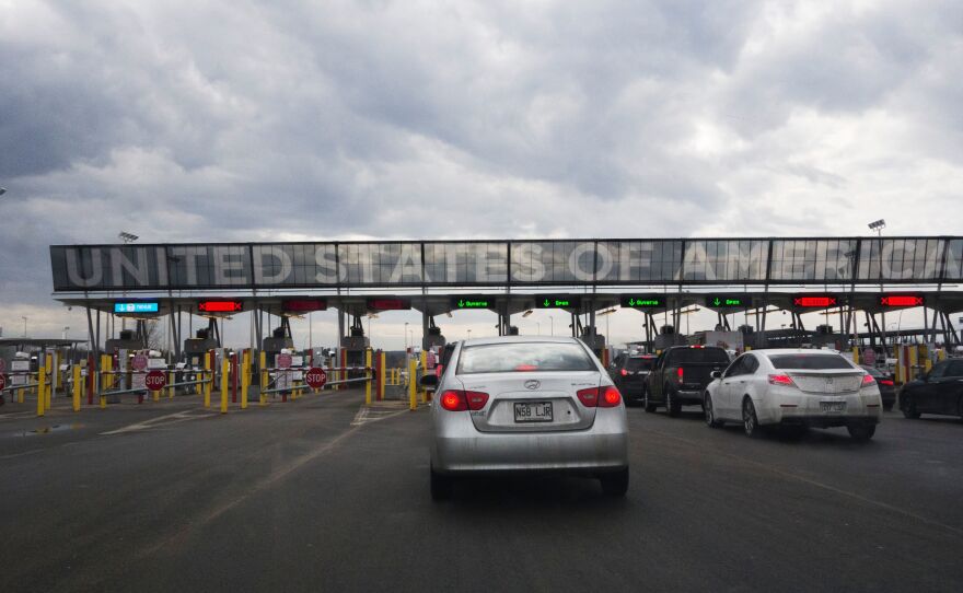 Cars line up to cross into the U.S. at the Canadian border on Feb. 25, in Saint-Bernard-de-Lacolle, Quebec.