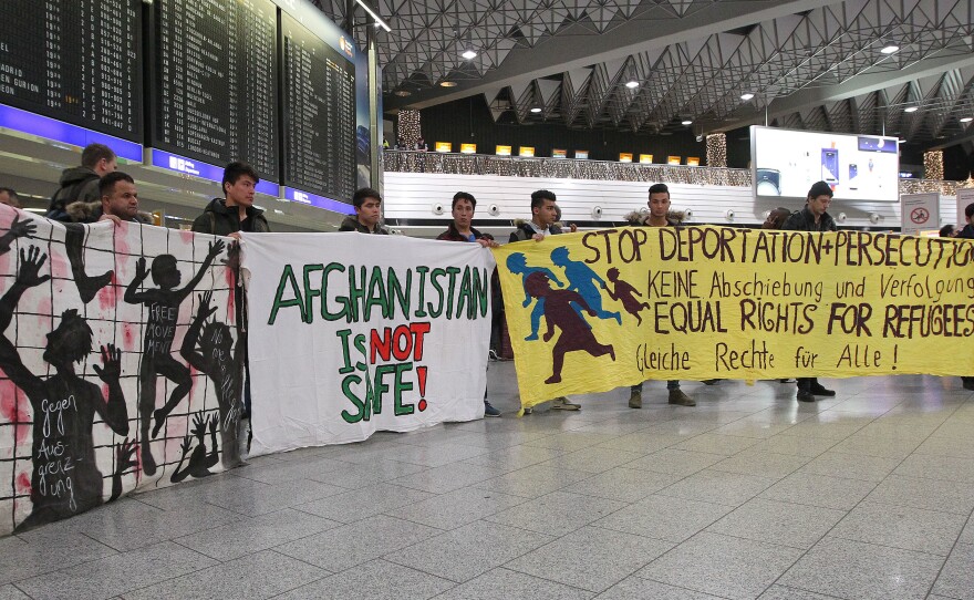 Demonstrators protest against the deportation of refugees back to Afghanistan at the Frankfurt, Germany, airport Wednesday night.