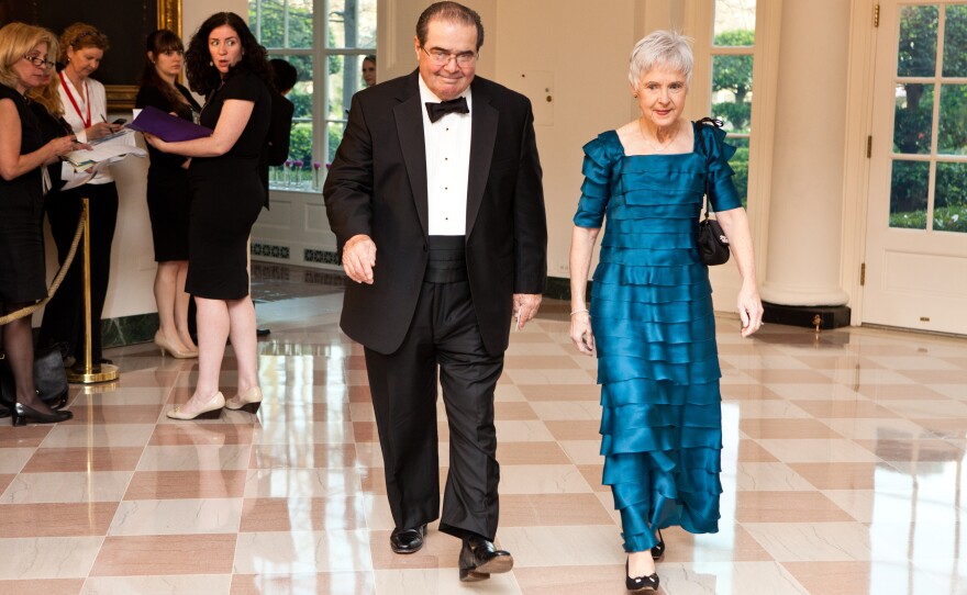 Supreme Court Justice Antonin Scalia and Maureen M. Scalia arrive for a State Dinner in honor of British Prime Minister David Cameron at the White House in March 2012 in Washington, D.C.