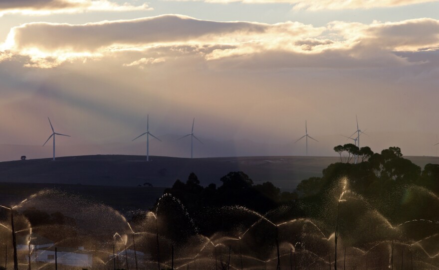 Wind turbines outside Caledon in Cape Town, South Africa. Solar and wind farms are filling in the gaps during power shortages.