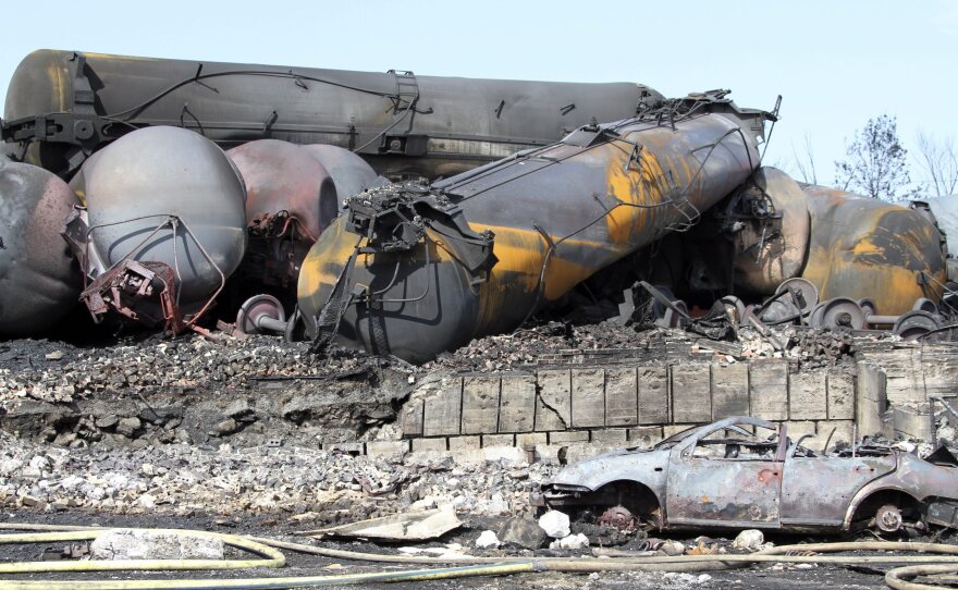 A police photograph shows burned and wrecked crude oil carrying rail tankers piled up in Lac-Megantic, Quebec, on Monday. Dozens of people died in the disaster.