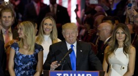 Republican presidential candidate Donald Trump is joined by his wife, Melania, right, and daughter Ivanka, left, as he arrives for a primary night news conference in New York, May 3, 2016.
