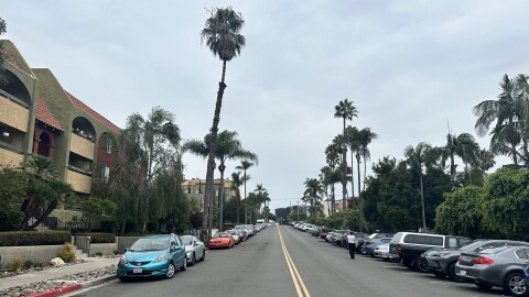 Cars parked along a tree-lined street in Hillcrest, San Diego on a cloudy day, Friday, Sept. 22, 2023. 