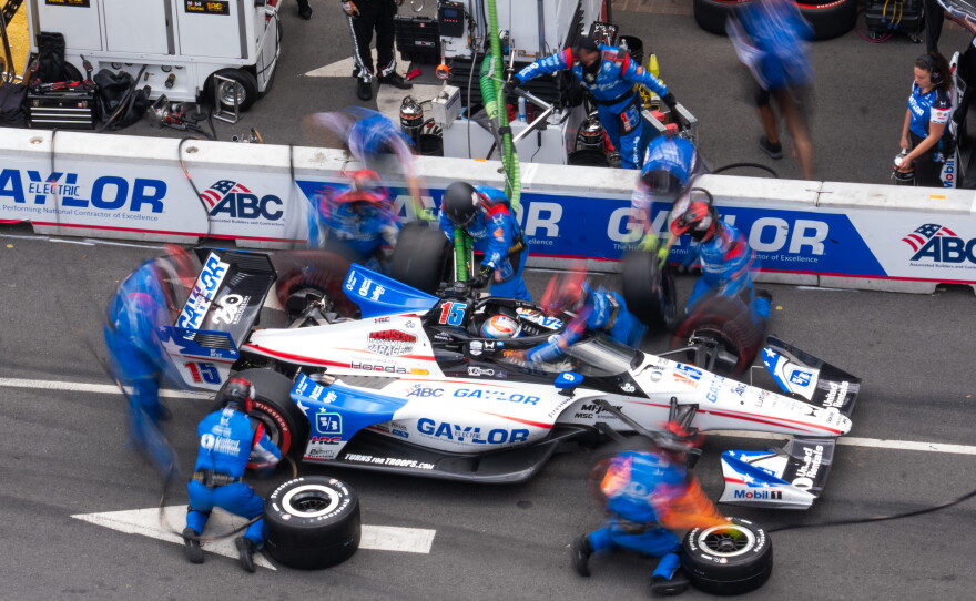 Graham Rahal (15) makes a pit stop during the Freedom 250 Grand Prix auto race, Sunday, Aug. 23, 2026, in Washington.(AP Photo/Allison Robbert)