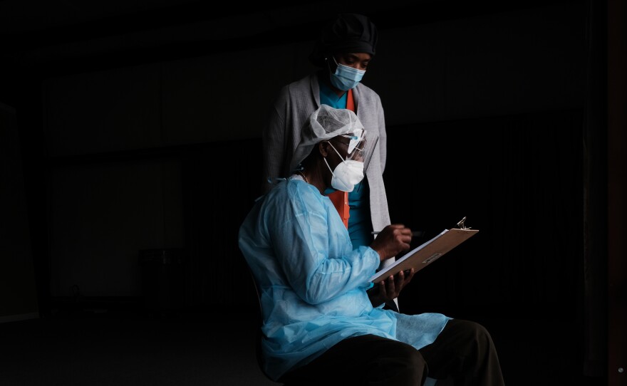 Medical workers wait to vaccinate people at a pop-up COVID-19 vaccination clinic in rural Mississippi.