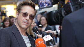 Robert Downey Jr. is interviewed upon arrival at the premiere for the film 'The Avengers Age of Ultron' in London, April 21, 2015. 