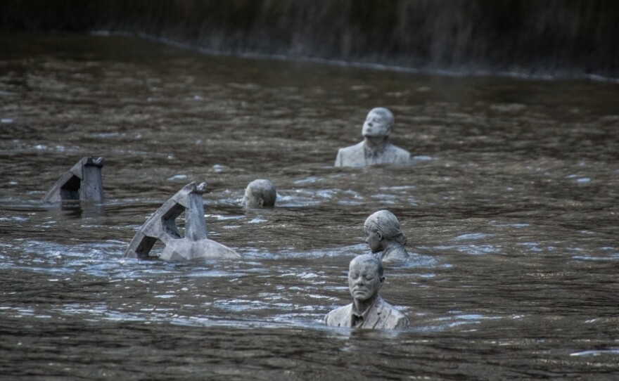 At high tide, the four sculptures of The Rising Tide are almost entirely submerged.