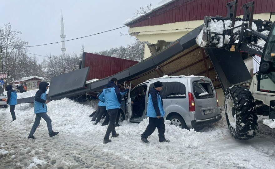 A view of a destroyed building in Turkey's southern province of Kahramanmaras on Monday. Heavy snow in the region is complicating search efforts.