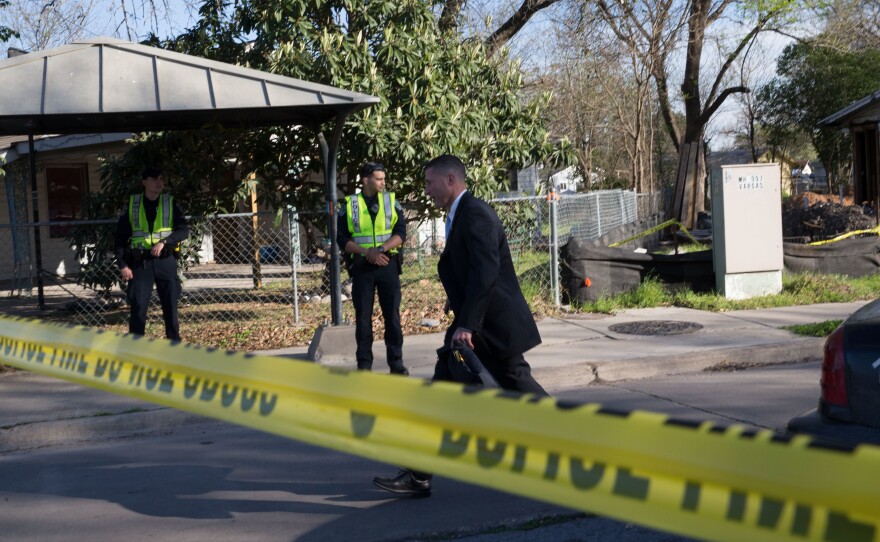Authorities examine the scene of a bombing in Austin, Texas, on March 12. A woman in her 70s was injured in the explosion. Officials have said there is a serial bomber attacking the Austin area.