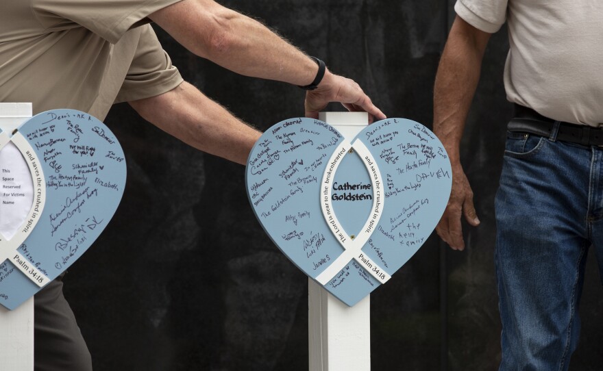 A memorial for the victims of the Highland Park shooting is set up.