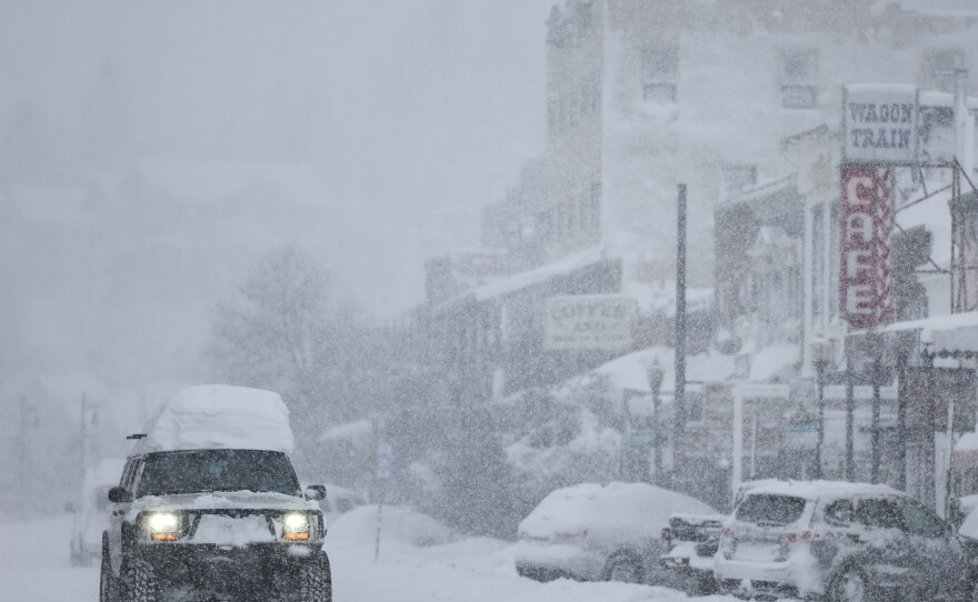 Snow falls downtown, north of Lake Tahoe, during a powerful multiple day winter storm in the Sierra Nevada mountains on Saturday in Truckee, California.