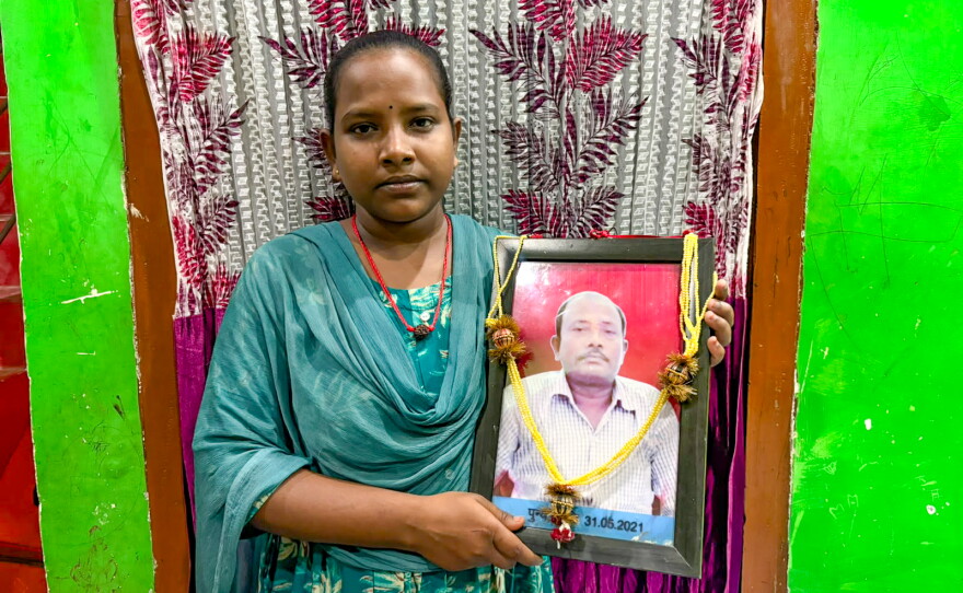 Jyoti Kumari holds a photo of her dad, Mohan Paswan. She became a global celebrity after news spread of her 700-mile bicycle ride, carrying her injured father on her bicycle, to get him to their village. Promises were made to reward her heroic feat. Were they kept?
