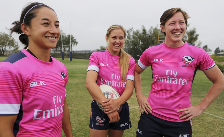 Kelly Griffin (left), Richelle Stephens and Jillion Potter stand together during practice.