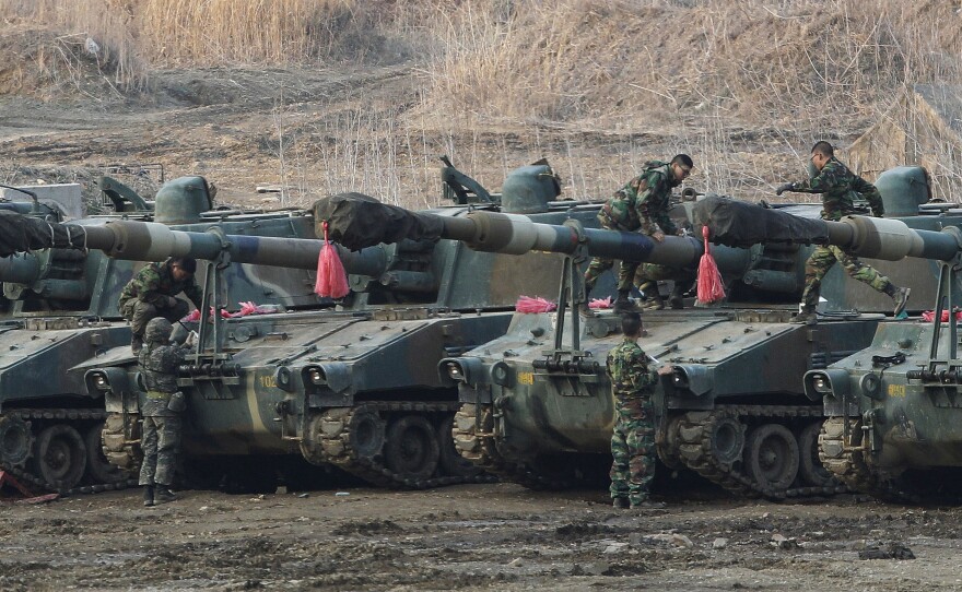 South Korean marines work on their K-55 self-propelled howitzers during an exercise against possible attacks by North Korea near the border village of Panmunjom in Paju, South Korea, Wednesday.
