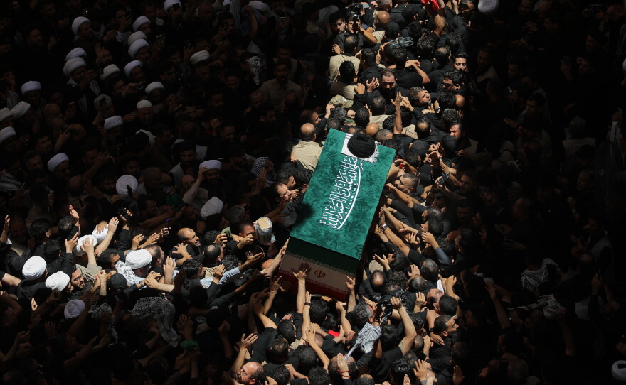 The coffin of the late Iranian Supreme Leader Ayatollah Ali Khamenei is carried by mourners to the Imam Ali Shrine in Najaf, Iraq, Wednesday, July 8, 2026.