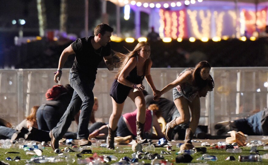 Concertgoers flee gunfire at the Route 91 Harvest country music festival in Las Vegas on Oct. 1.