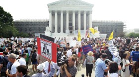 Supporters and protesters gather in front of the U.S. Supreme Court to find out the ruling on the Affordable Health Act June 28, 2012 in front of the U.S. Supreme Court in Washington, DC. 