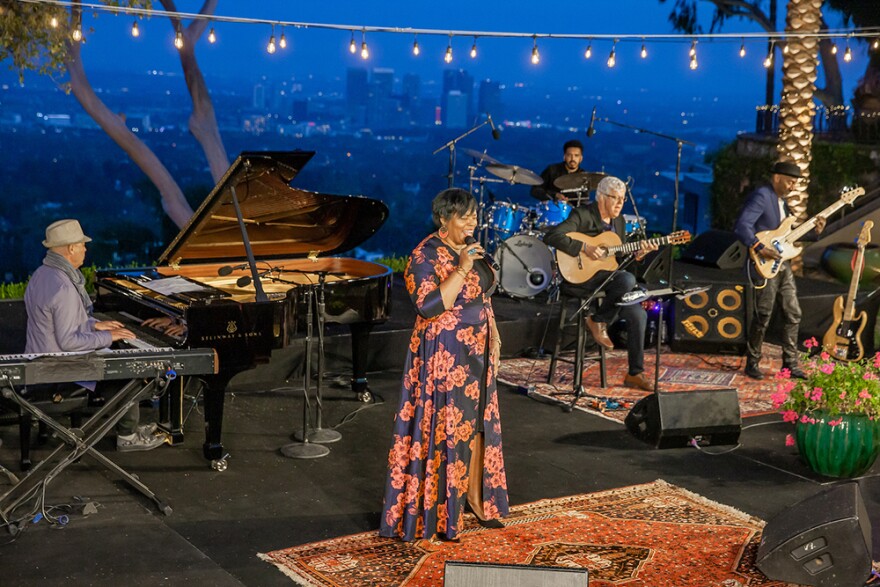 Dianne Reeves performs with (from left) Musical Director John Beasley, Justin Tyson, Romero Lubambo and Marcus Miller at Jazz Day 2021.