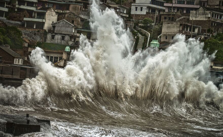 A wave amplified by a typhoon smashes onto the shores of Shengshan, Zhoushan City, China.