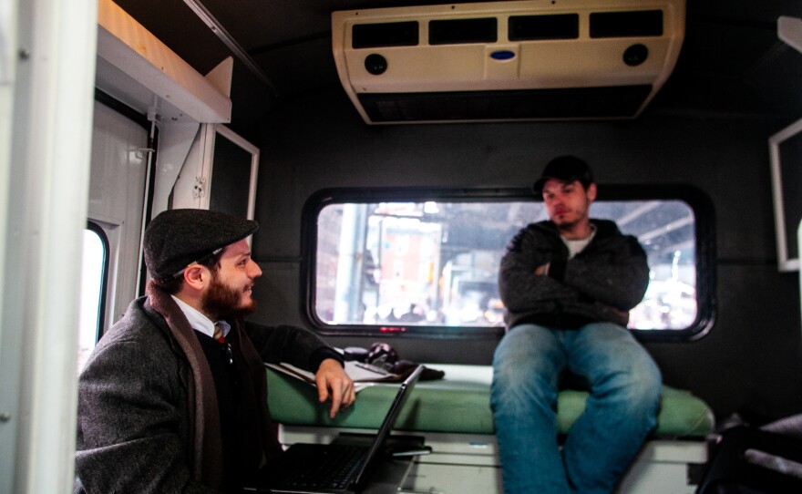 Inside the exam room on the "bupe bus," as the mobile medical clinic is called, Dr. Ben Cocchiaro and Louis Morano talk over Morano's options. Morano says he's committed to his recovery this time and wants the support of buprenorphine to help him quit heroin.