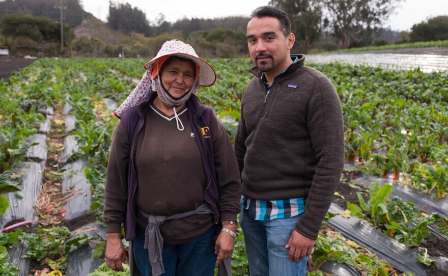 Farm owner Bertha Magaña and her kitchen table adviser, David Mancera, pose at Magaña's farm in Prunedale.