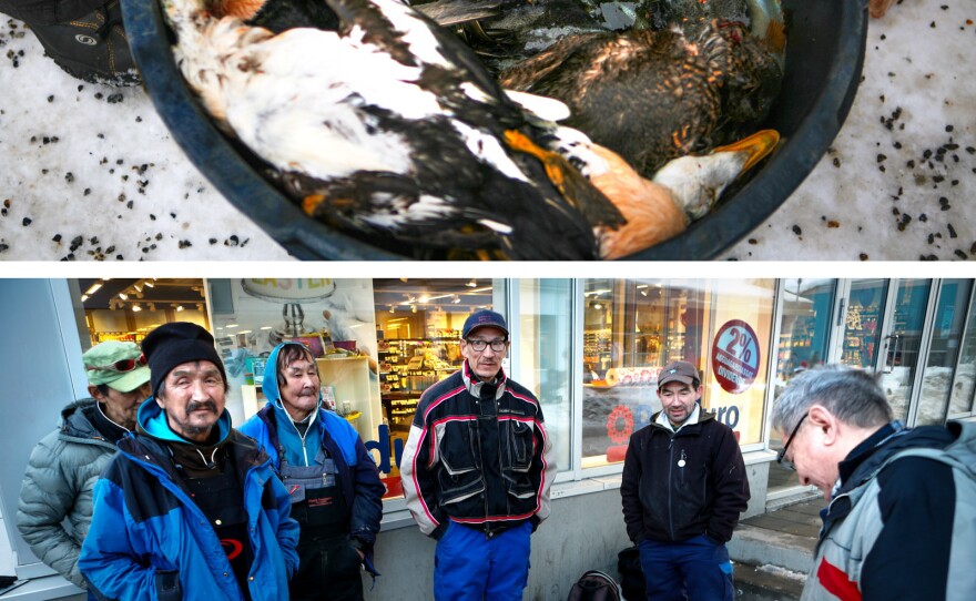 Hunters and fishermen offer the day's catch for sale outside a Nuuk supermarket.