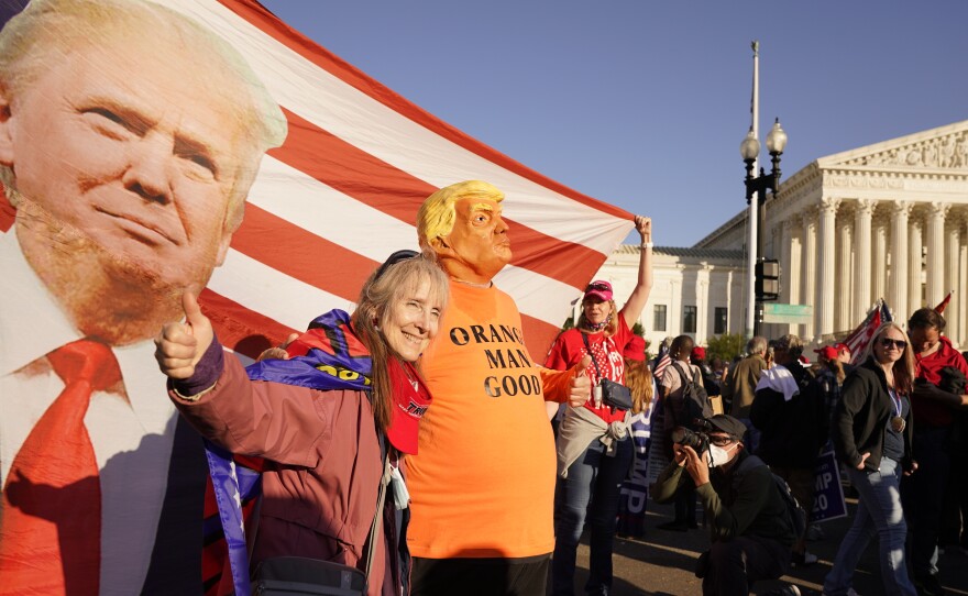 Supporters of President Trump attend pro-Trump marches outside the Supreme Court building in Washington on Nov. 14. The Trump team was dealt several losses in multiple courts Friday.
