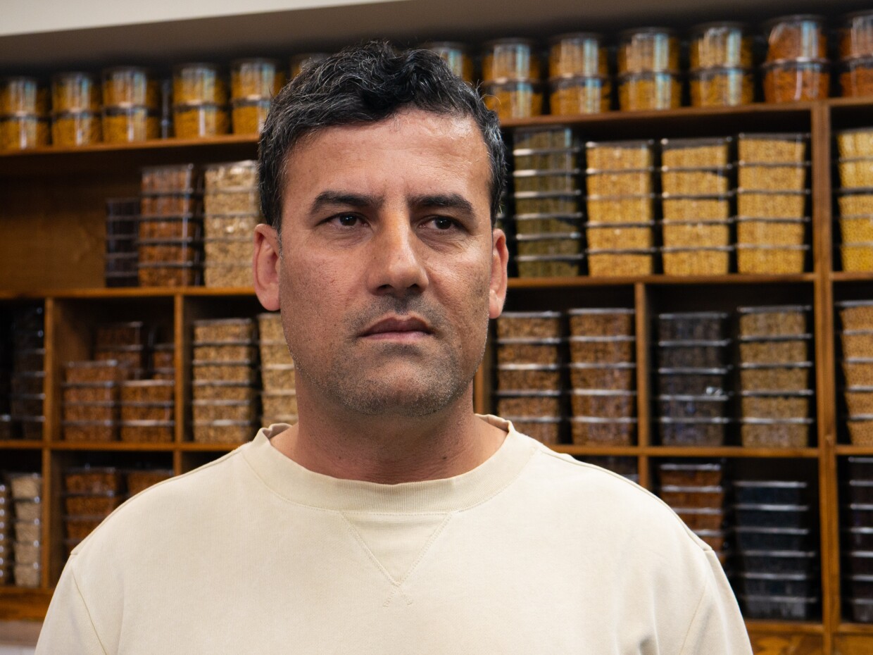 Wahid Sediqi stands for a portrait photo in Kabul Green Market on May 4, 2026.