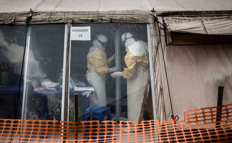Health workers inside the "red zone" of an Ebola treatment center in Butembo, which was attacked on March 9.