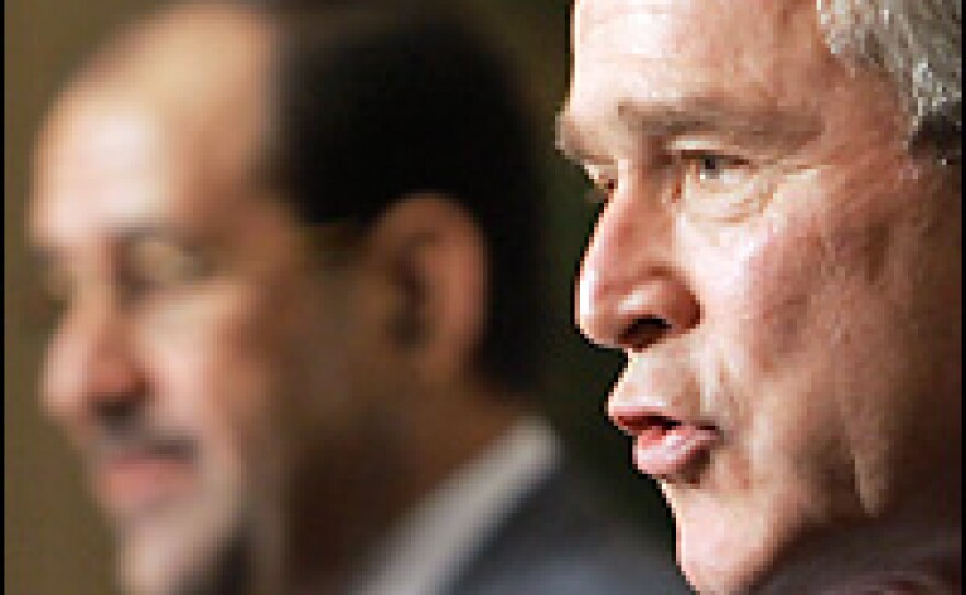 U.S. President George W. Bush speaks during a news conference with Iraqi Prime Minister Nouri Maliki (far left) at the Four Seasons Hotel in Amman, Jordan, on Thursday.