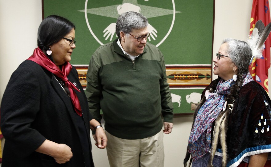 Attorney General William Barr speaks with Myrna DuMontier (left) and Charmel Gillin (right), councilwomen with the Confederated Salish and Kootenai Tribes on Friday on the Flathead Reservation in Pablo, Mont.