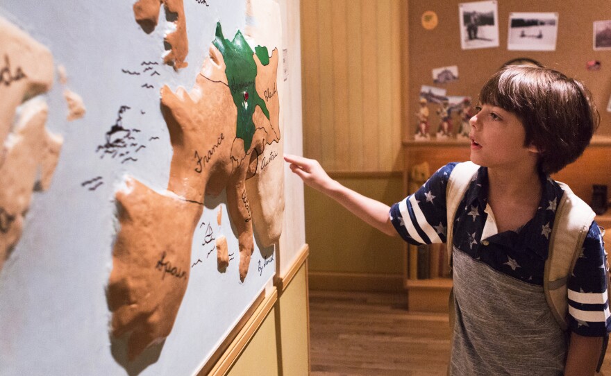 Aiden Hunter, 9, looks at a map of Europe to learn more about where the Holocaust took place in the children's exhibit at the United States Holocaust Museum in Washington D.C. The Museum has an interactive children's exhibit that uses the fictional story of a boy named Daniel to teach children about the Holocaust.