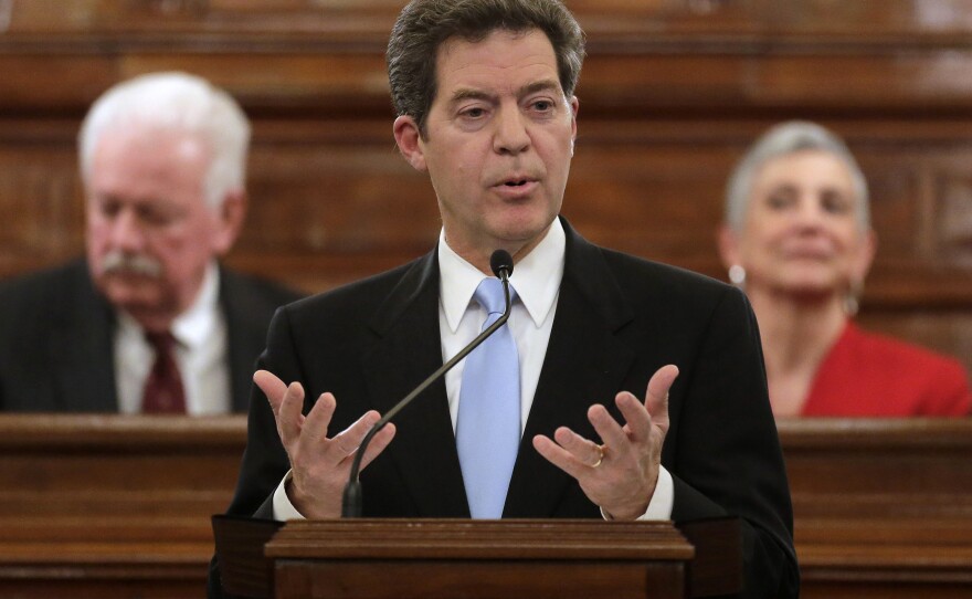 Kansas Gov. Sam Brownback, shown delivering the State of the State address last month, is pushing to get rid of the state's income tax, which has some Republicans concerned.