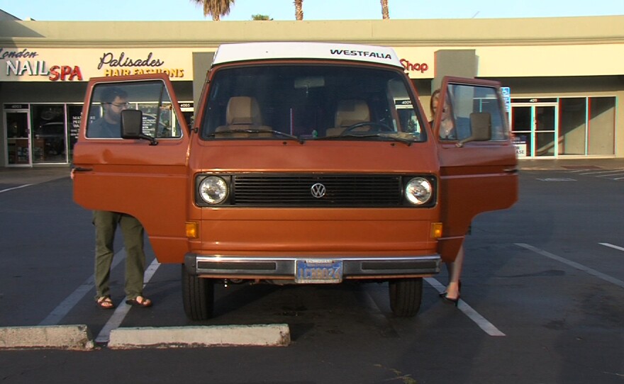 Travis Pritchard and Jamie Hampton climb into Hampton's van to hunt down the source of a puddle of water in Point Loma, April 10, 2015.