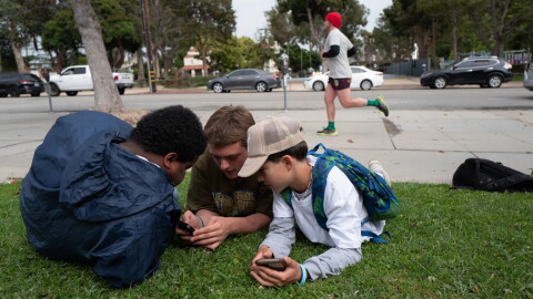 The California Legislature is considering bills to safeguard children from chatbots and curb addictive social media for kids. Students of Saint Monica Preparatory hang out after school in Santa Monica. May 24, 2023.