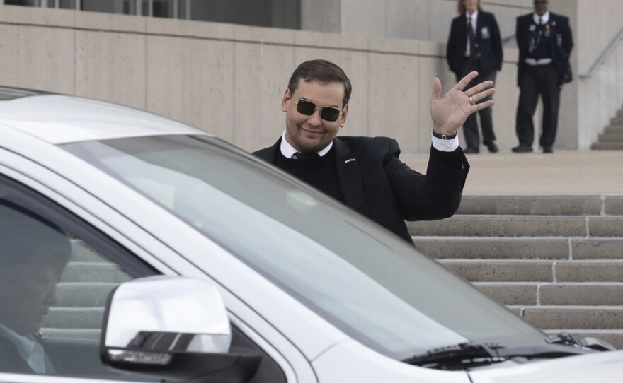 U.S. Rep. George Santos leaves the federal courthouse in Central Islip, N.Y., on Friday after pleading not guilty to charges in a revised indictment.
