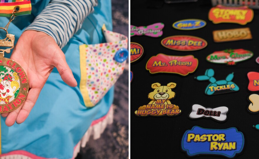 Robin Bryan "Pinkie Bee" holds up her medal. On the right, name tags with clown names were on display.