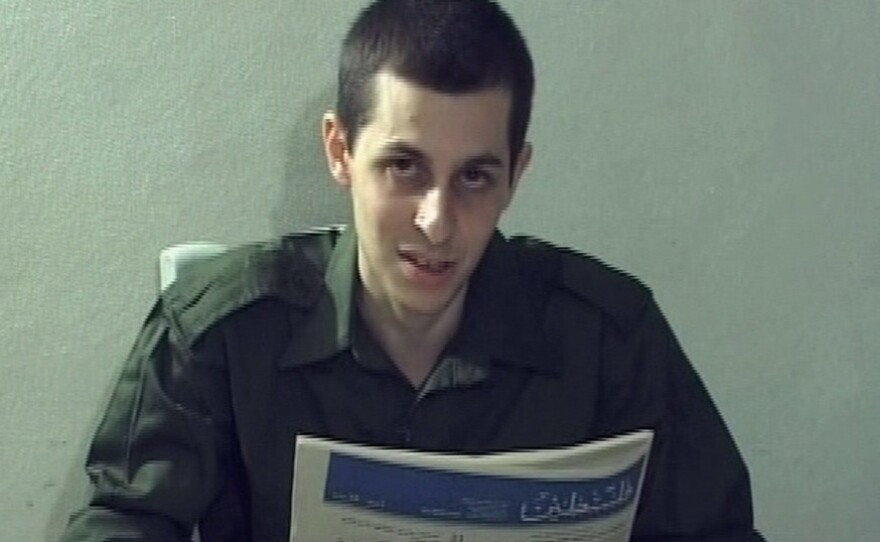 <p>In this video grab released on Oct. 2, 2009, captured Israeli soldier Gilad Shalit is seen holding a Palestinian newspaper. Shalit, who has been held by Palestinians for more than five years, is set to be released Tuesday.</p>