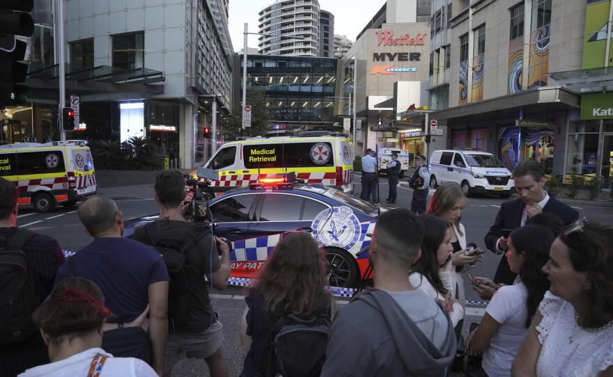 A crowd gathers outside Westfield Shopping Centre in Sydney on Saturday, April 13, 2024.